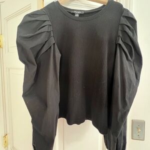 black fitted top with puff sleeves